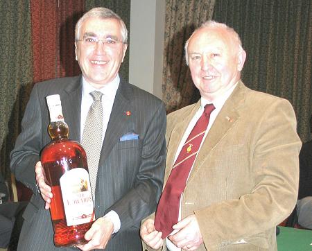 James Hagerty receiving whisky from Brian Salmon. pic:BernardSwift