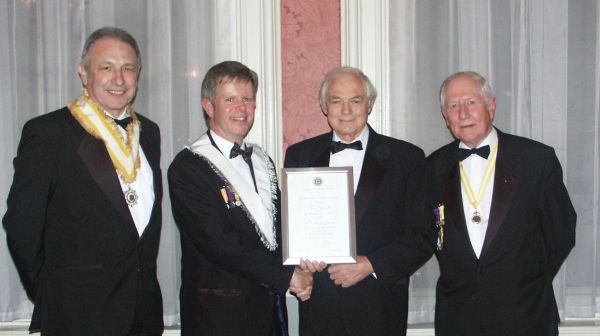 Tom Doyle receives his 40-year scroll. pic:HN