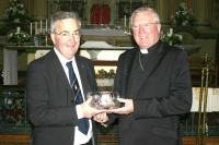 President Richard Percival presents Rt Rev Terence Drainey with a Centenary bowl. pic:Bernard Swift