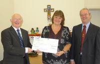 Margaret Siberry, CAFOD, receiving a cheque from Harrogate Circle