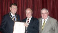 Kevin Speight receiving his 50 year scroll from Grand President pic:HN