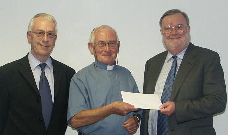 Fr Hanlon receiving cheque. PIC:HN