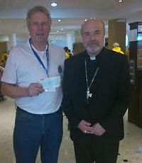 Paul Mallinson presenting cheque to Bishop Marcus
